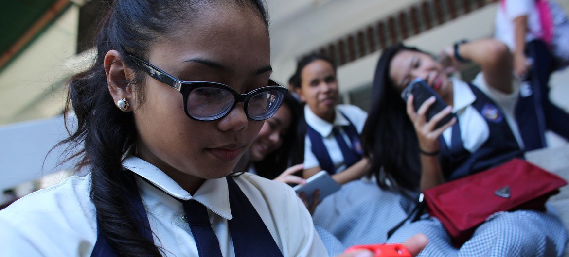 young girl with phone ai threats